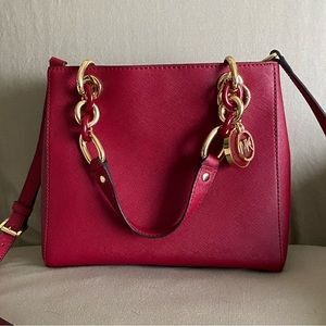 MK Vinyl Dark Red Crossbody with gold and plastic link handles.
